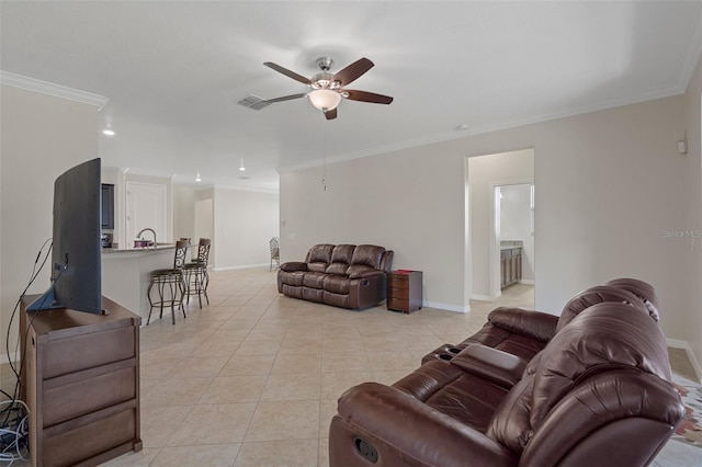 living area featuring light tile patterned floors, a ceiling fan, baseboards, visible vents, and crown molding