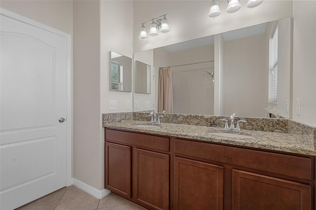 full bath with tile patterned flooring, a sink, a shower with shower curtain, and double vanity