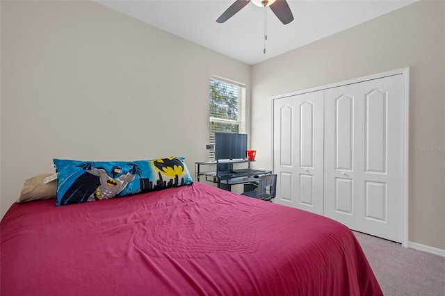 bedroom featuring carpet floors, a closet, ceiling fan, and baseboards