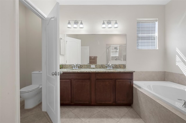 bathroom with a garden tub, tile patterned floors, a sink, and a shower stall