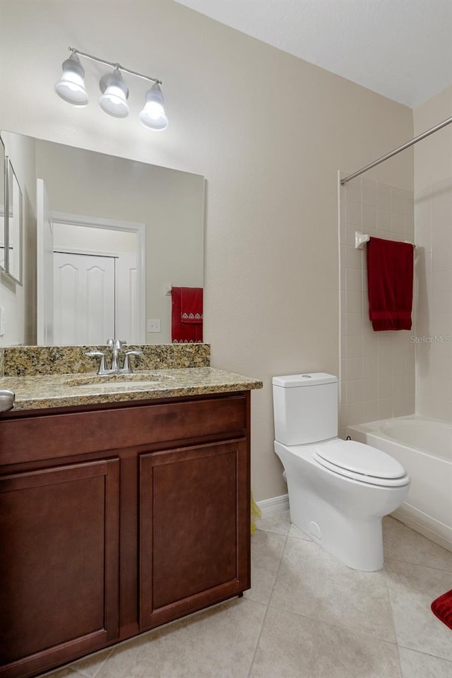 bathroom featuring bathing tub / shower combination, vanity, toilet, and tile patterned floors