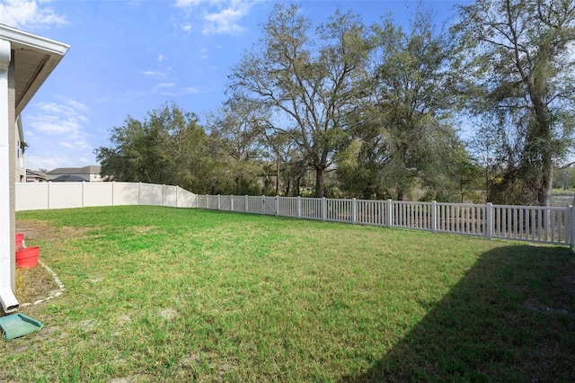 view of yard with a fenced backyard