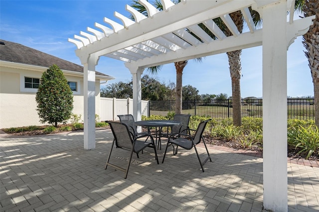 view of patio / terrace featuring a fenced backyard, outdoor dining area, and a pergola