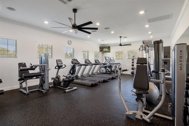 gym with a textured ceiling, recessed lighting, visible vents, baseboards, and crown molding