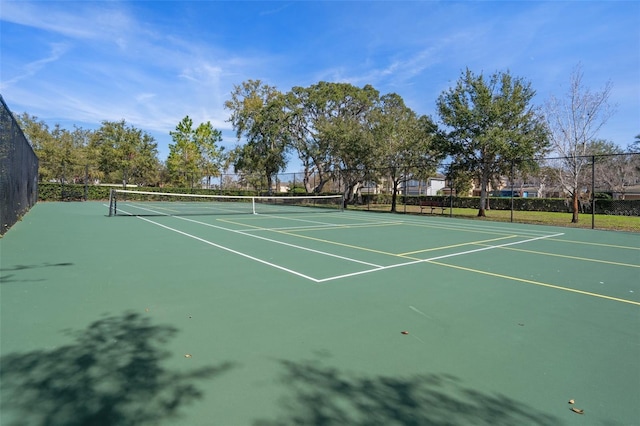 view of sport court with fence