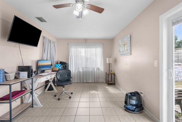 office with ceiling fan and light tile patterned floors