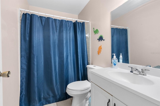 bathroom with toilet, vanity, tile patterned floors, and curtained shower