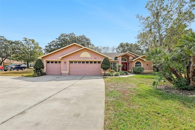 ranch-style home featuring a garage and a front lawn