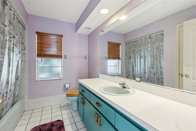 full bathroom featuring toilet, vanity, tile patterned flooring, and shower / bath combo