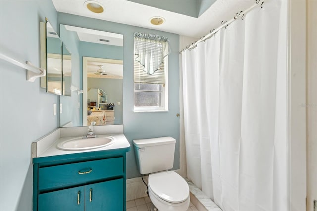 bathroom featuring toilet, tile patterned floors, and vanity