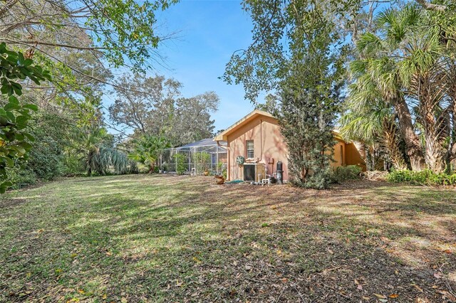 view of yard featuring a lanai