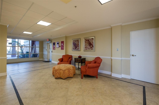 living area with light tile patterned floors and ornamental molding