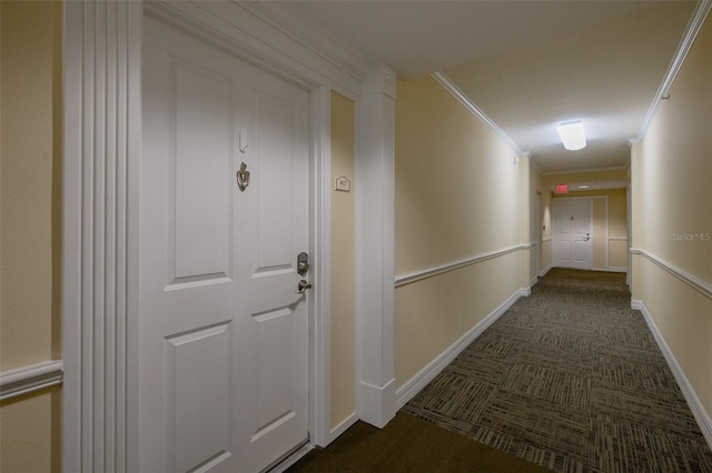 corridor featuring ornamental molding and dark carpet