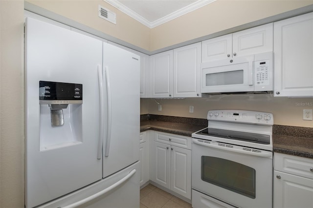 kitchen with light tile patterned floors, crown molding, white cabinets, and white appliances