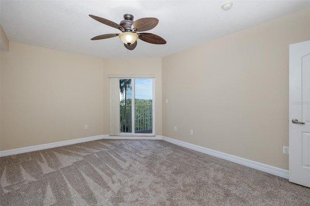 spare room featuring ceiling fan and carpet flooring