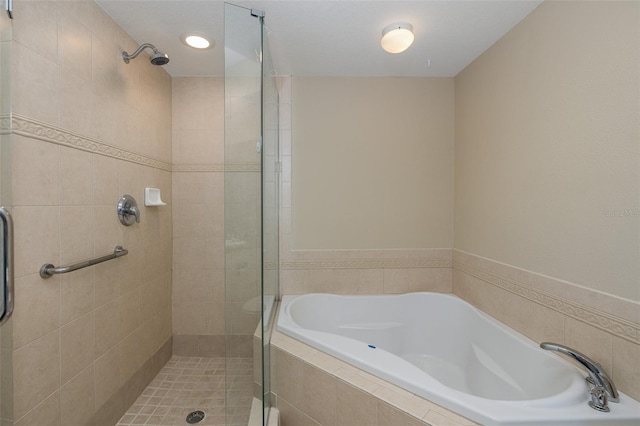 bathroom with separate shower and tub