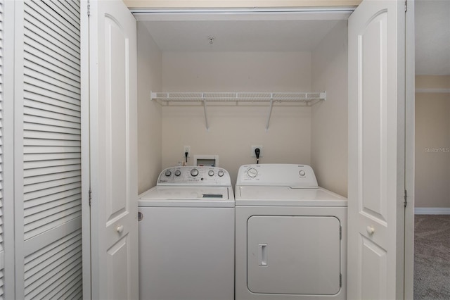 laundry area featuring carpet floors and washer and clothes dryer