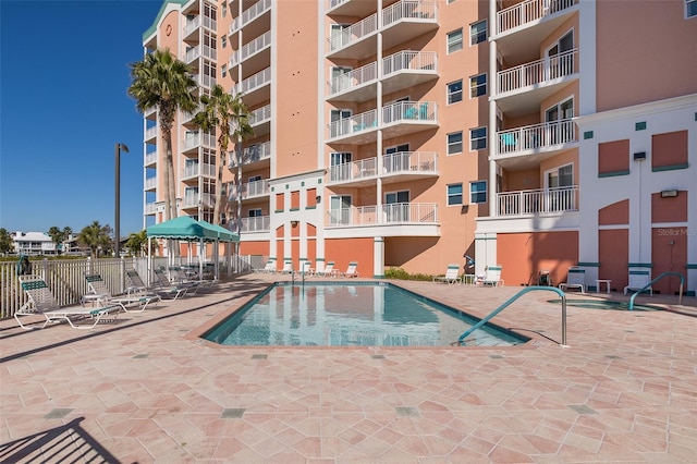 view of pool featuring a patio area