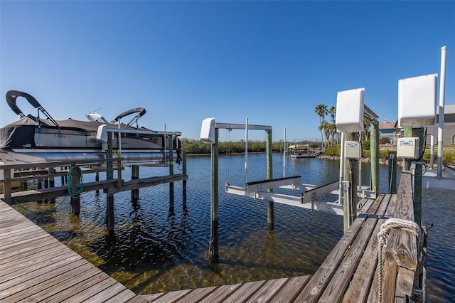 dock area with a water view