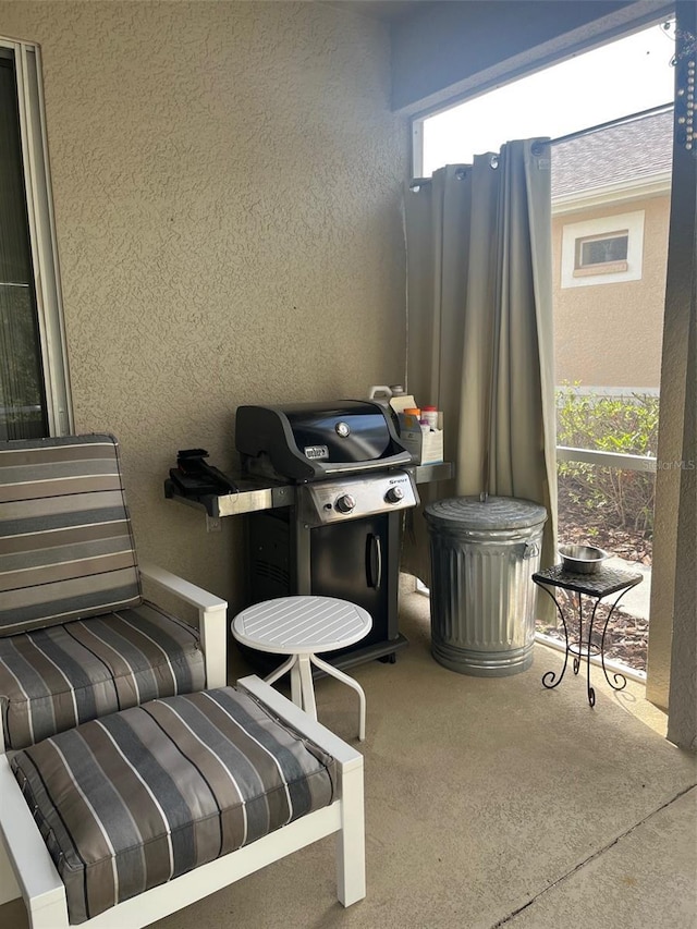 view of patio featuring a balcony