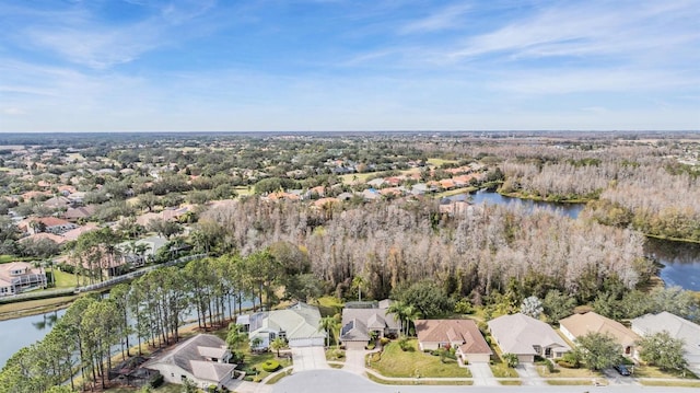 drone / aerial view featuring a residential view and a water view