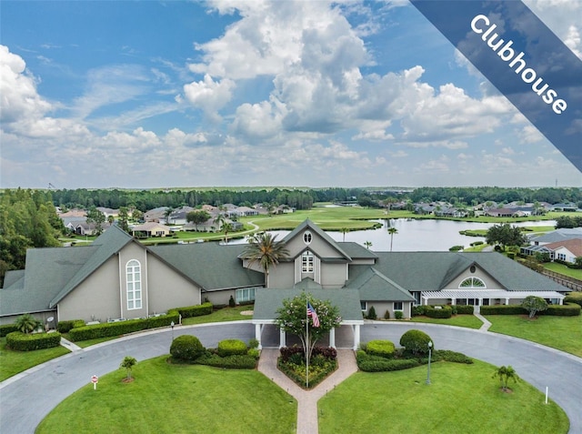 drone / aerial view with a residential view and a water view