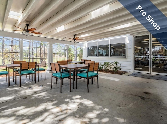 sunroom with a ceiling fan