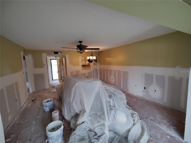 interior space featuring a textured ceiling and an inviting chandelier