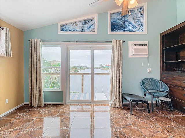 entryway featuring ceiling fan, lofted ceiling, and a wall mounted air conditioner