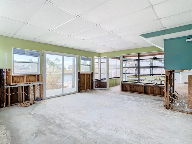 unfurnished sunroom with a paneled ceiling