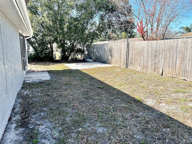 view of yard with a fenced backyard