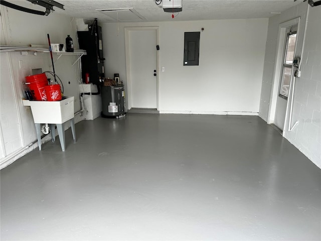 garage featuring a garage door opener, electric panel, and water heater