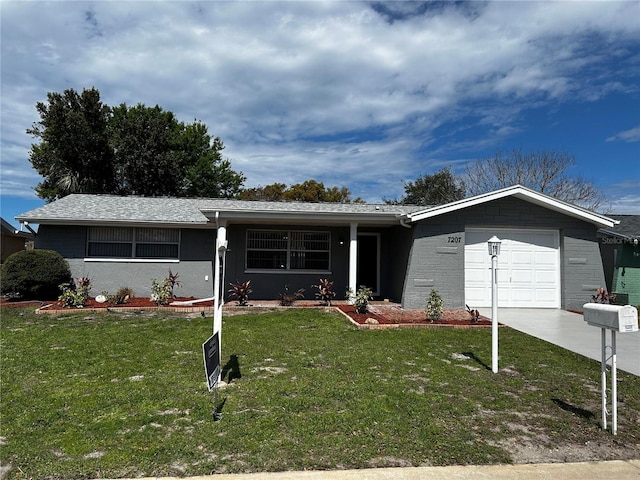 single story home with a garage, concrete driveway, and a front lawn