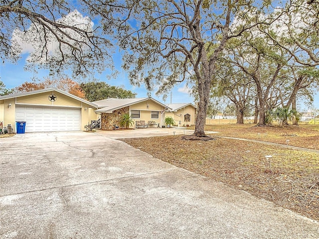 ranch-style home featuring a garage