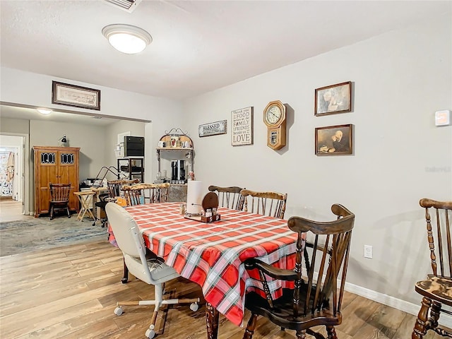 dining area featuring hardwood / wood-style floors