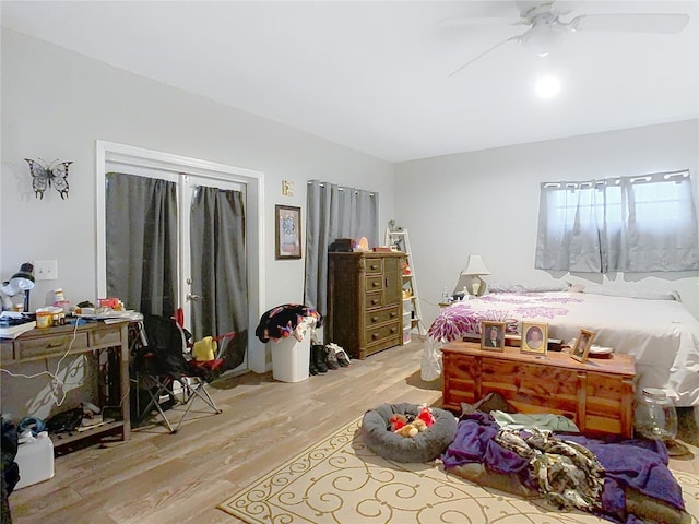 bedroom with light wood-type flooring and ceiling fan