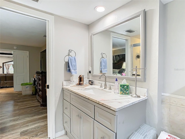 bathroom featuring vanity and wood-type flooring