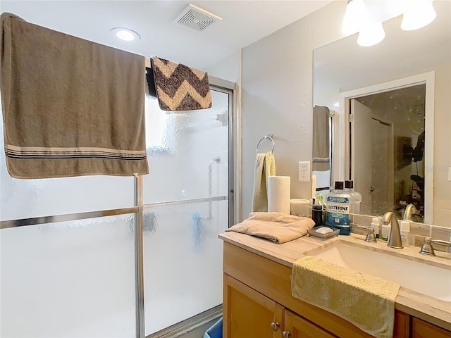 bathroom with vanity and an enclosed shower