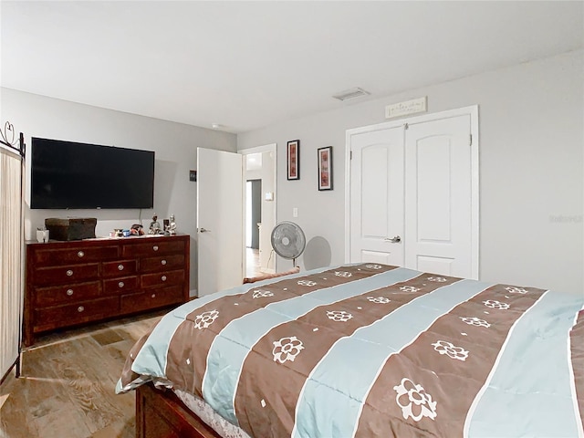 bedroom featuring a closet and wood-type flooring