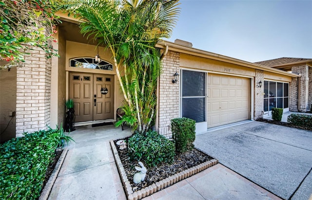 view of exterior entry featuring a garage