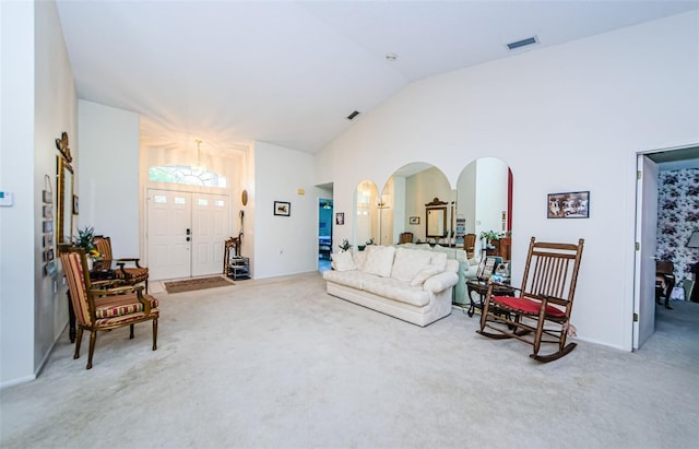 living room with lofted ceiling and carpet floors