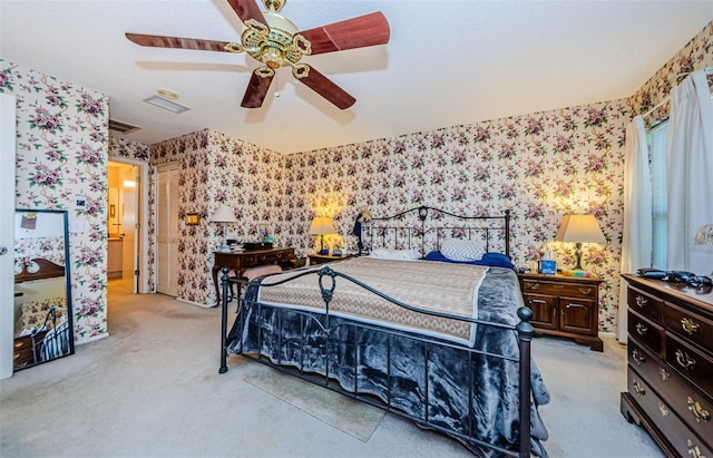 bedroom featuring light carpet and ceiling fan