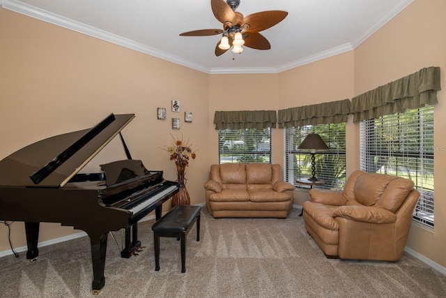 sitting room featuring ceiling fan, ornamental molding, and carpet floors