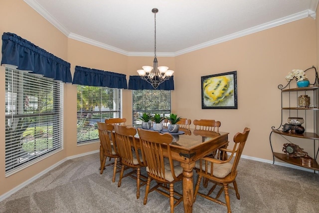 dining room featuring carpet, ornamental molding, and a notable chandelier