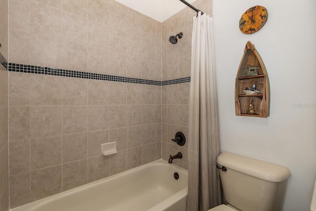 bathroom featuring toilet and shower / tub combo