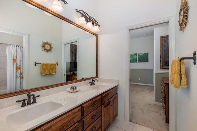 bathroom with tile patterned floors and vanity