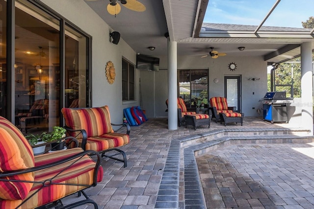 view of patio / terrace featuring ceiling fan, an outdoor hangout area, a grill, and a lanai