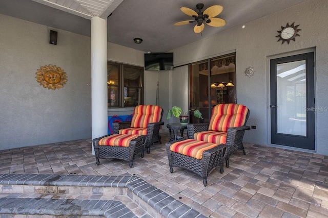 view of patio / terrace with ceiling fan and outdoor lounge area