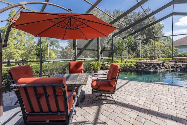 view of patio / terrace with a lanai, pool water feature, and a water view