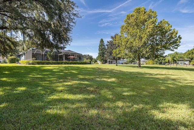 view of yard featuring a lanai